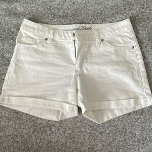 Size 2 white jean shorts. One small stain by left hip.